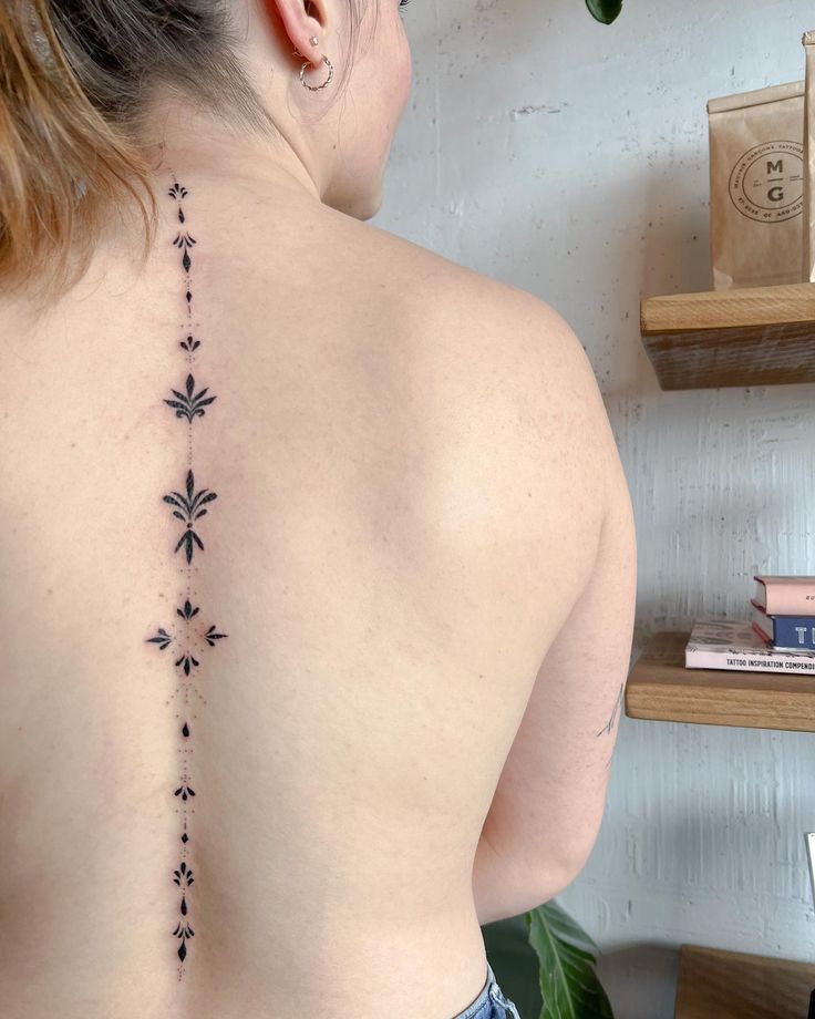 24 Spine Tattoo Designs For Strong Women