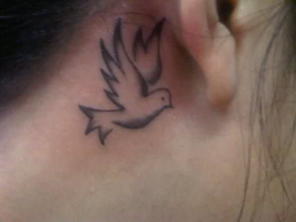 holy spirit) behind ear tattoo. love it but too big & too low...but maybe  if it was in the clear/UV ink?