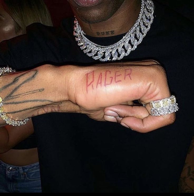 Travis Scott with Mr. Rager tat