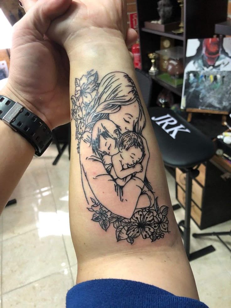 Pure love of mother and two kids #mothertattoo #twokids #motherslove  #armtattoo