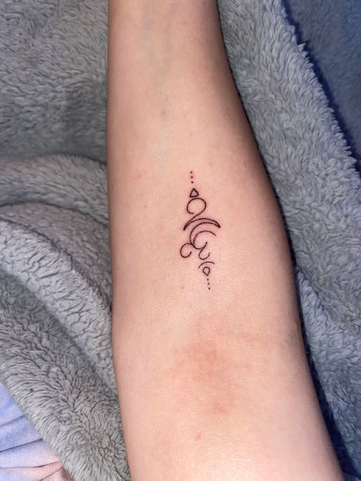 Breathe symbol tattoo