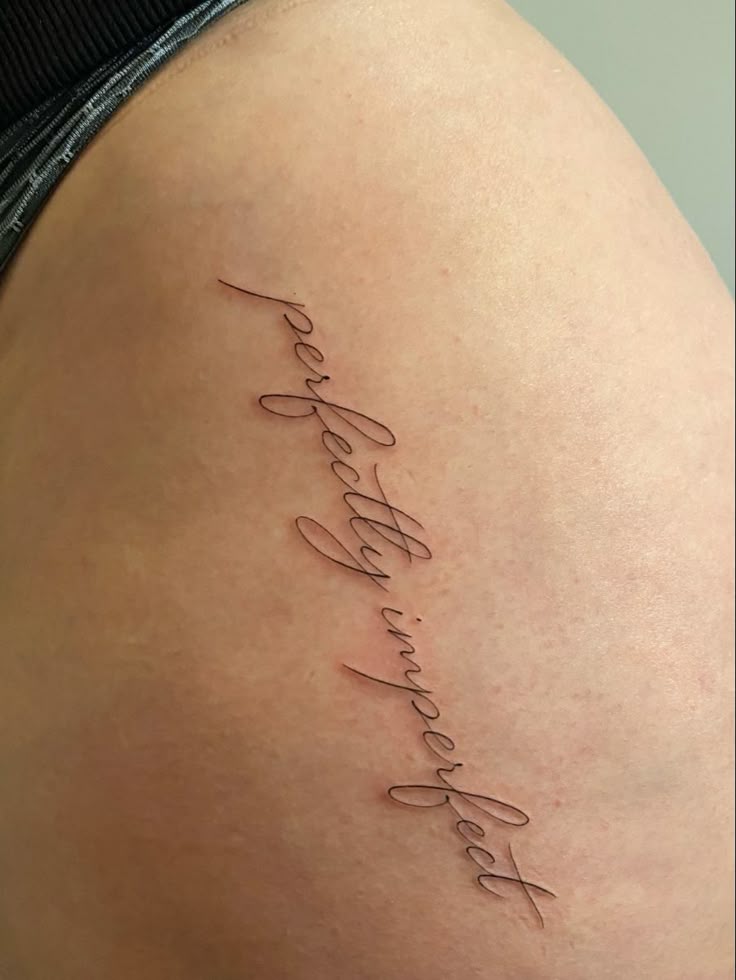 Hip script tattoo