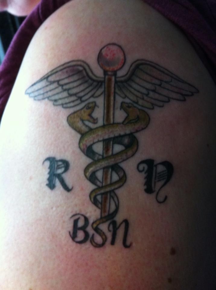 RN/BSN tattoo left upper arm