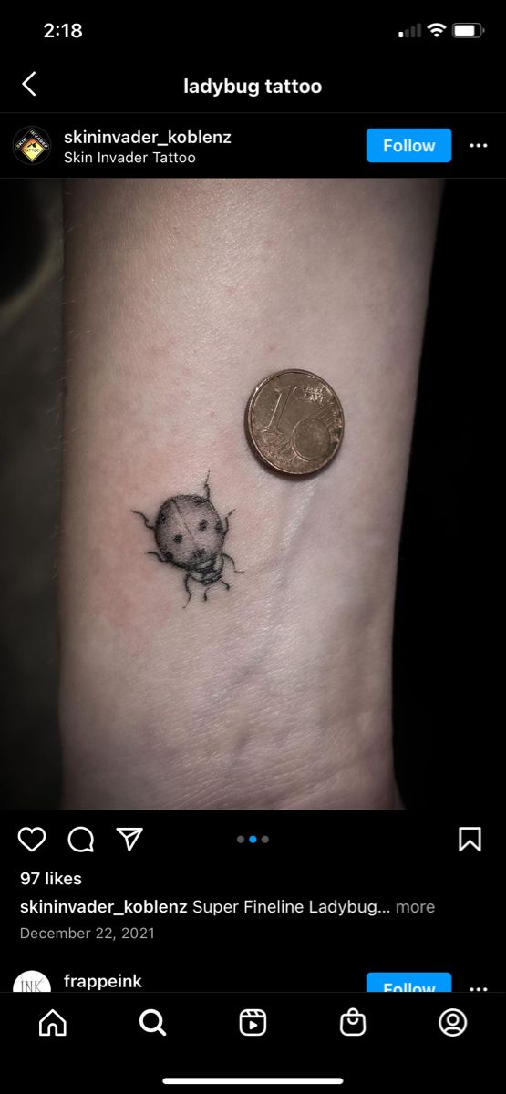 Fine line ladybug tattoo