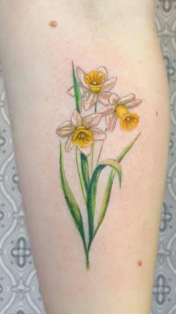 Daffodil Tattoos: Meanings, Tattoo Designs & Ideas | Daffodil tattoo, Birth  flower tattoos, Tattoos
