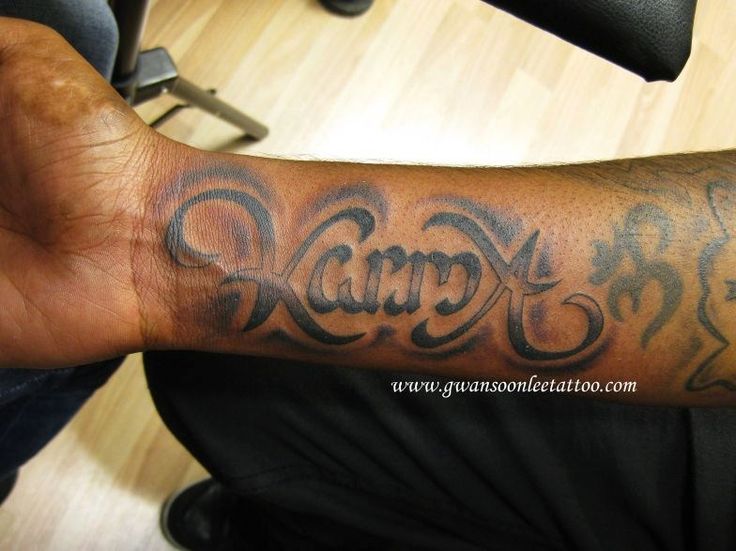 Karma ambigram tattoo