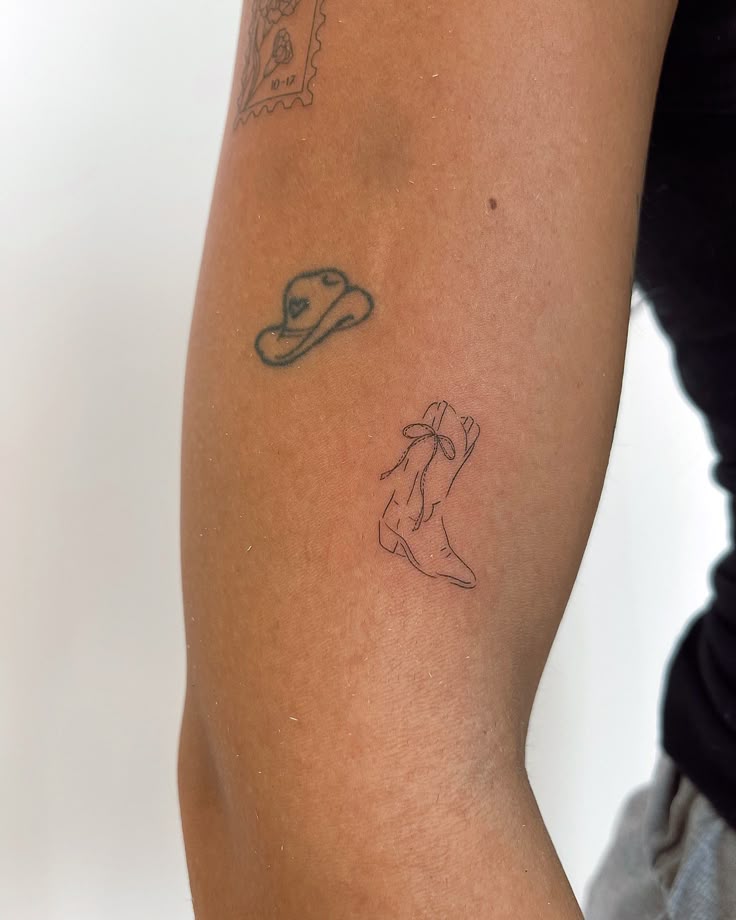 Cowboy boot with bow tattoo, coquette tattoos