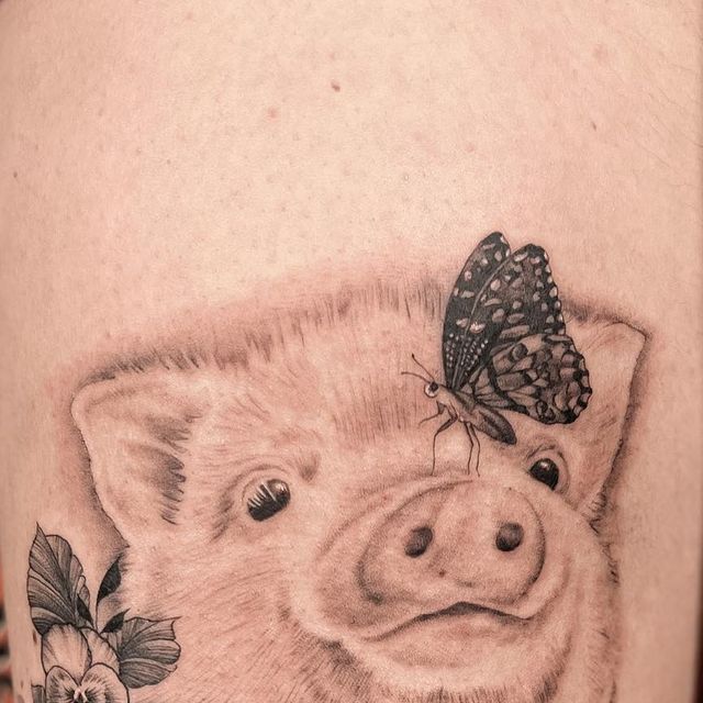 Adorable Pig Tattoo with Butterfly