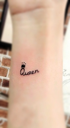 Letters queen tattoo with a crown