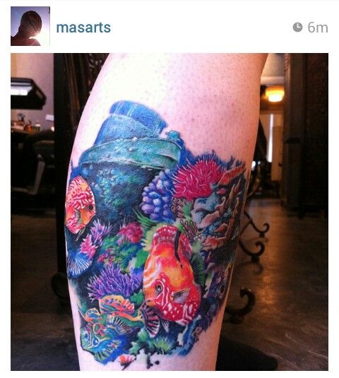 Underwater tattoo with coral