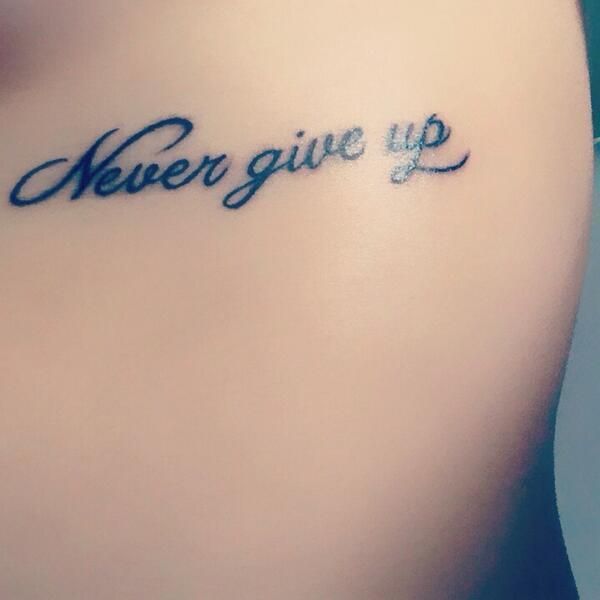Tattoo "Never give up"
