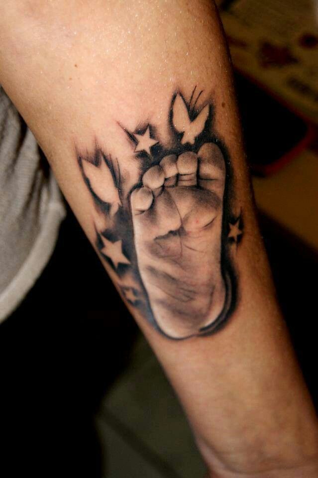 Babies foot with negative butterflies and stars