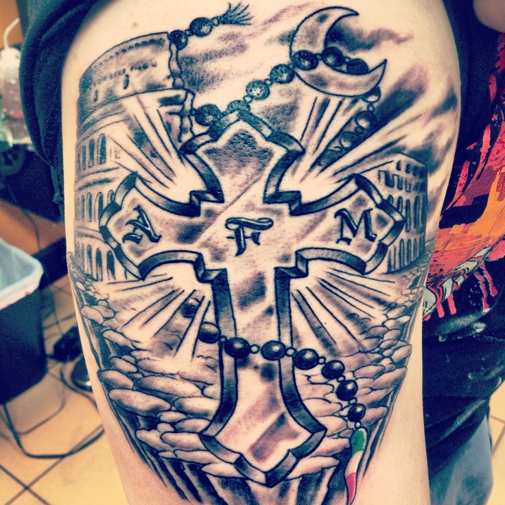 My boyfriends new tattoo of an Italian cross with the colosseum in the  background, it's amazing!