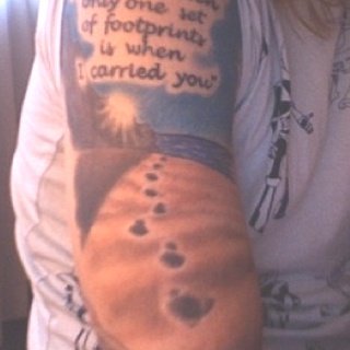Going to get a similar tattoo just different art. Foot prints in the sand  poem