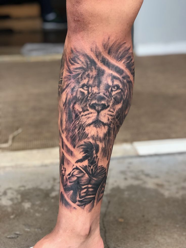 Tattoos of lion on leg