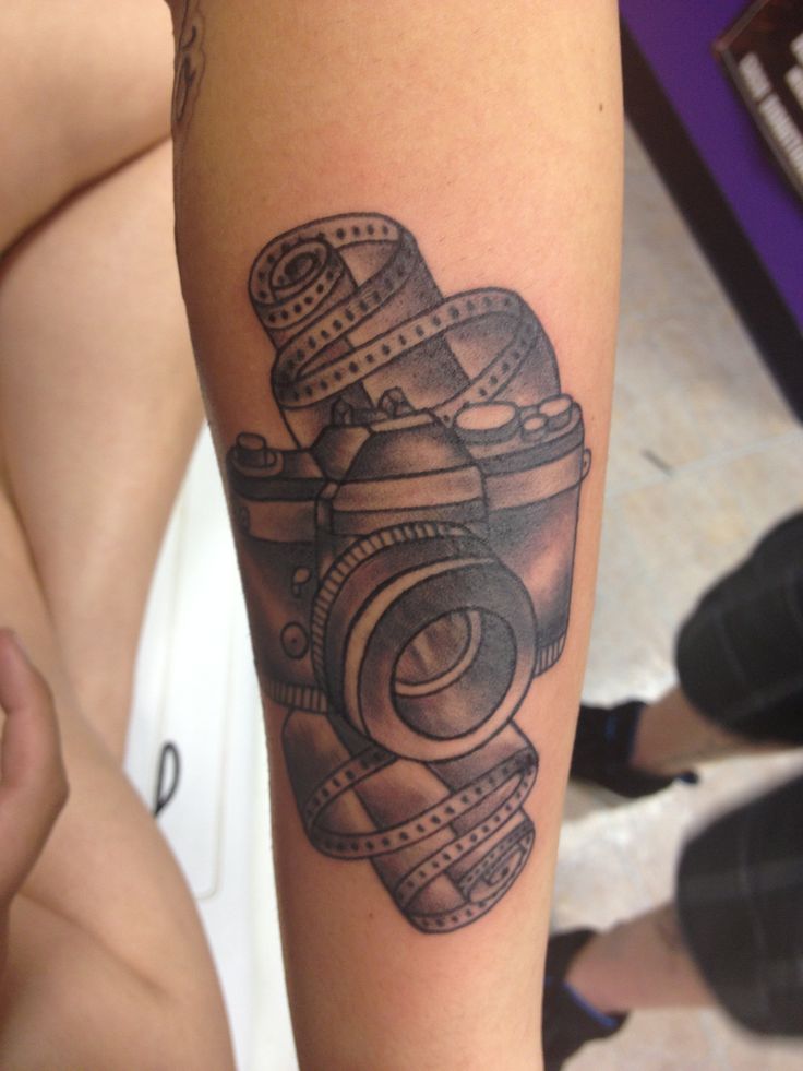 Camera and film tattoo, done by Tary Noe #tattoos