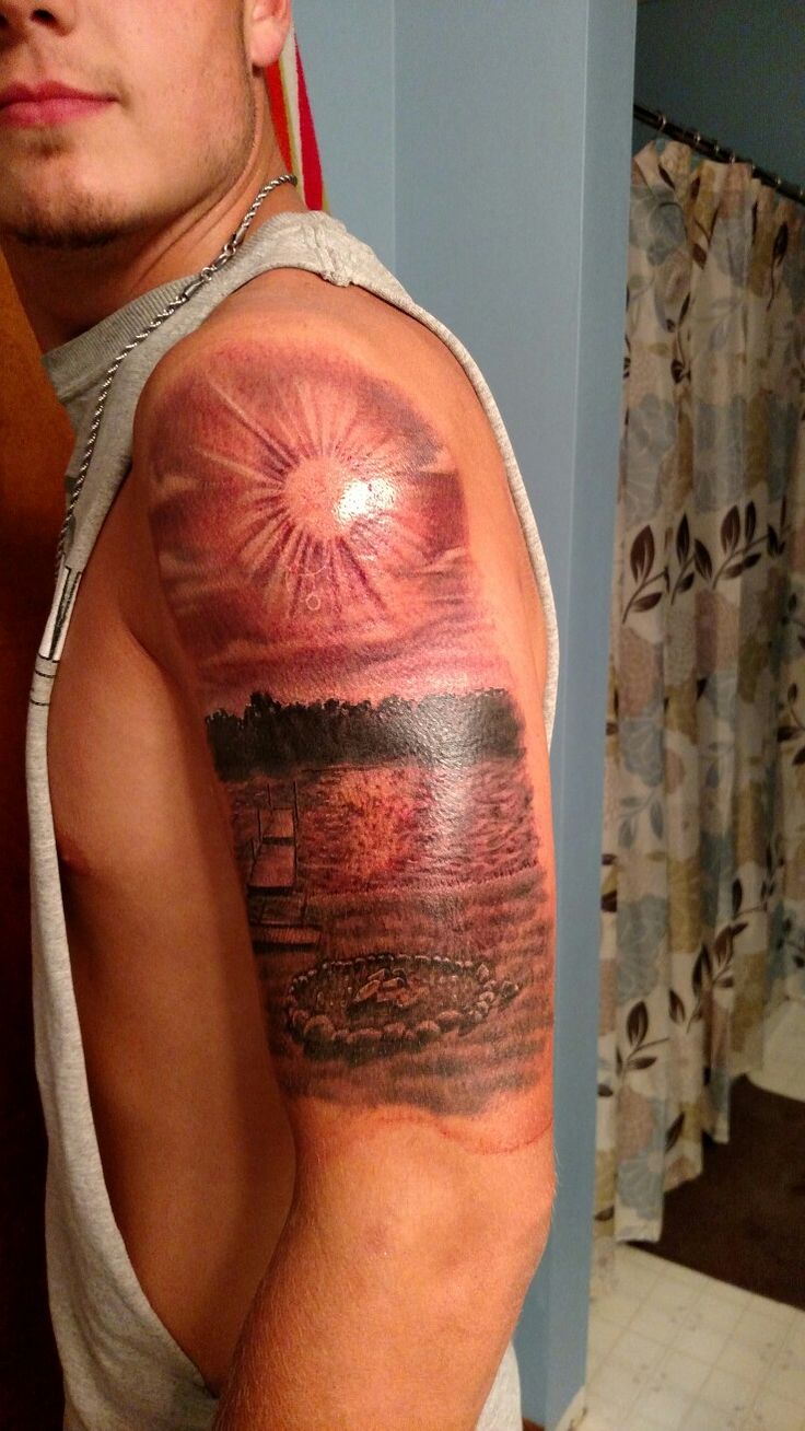 Tattoo of lake dock and sun