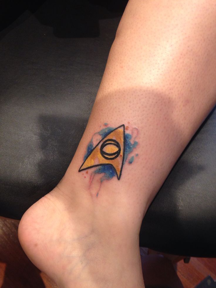 Abstract watercolor Star Trek symbol tattoo