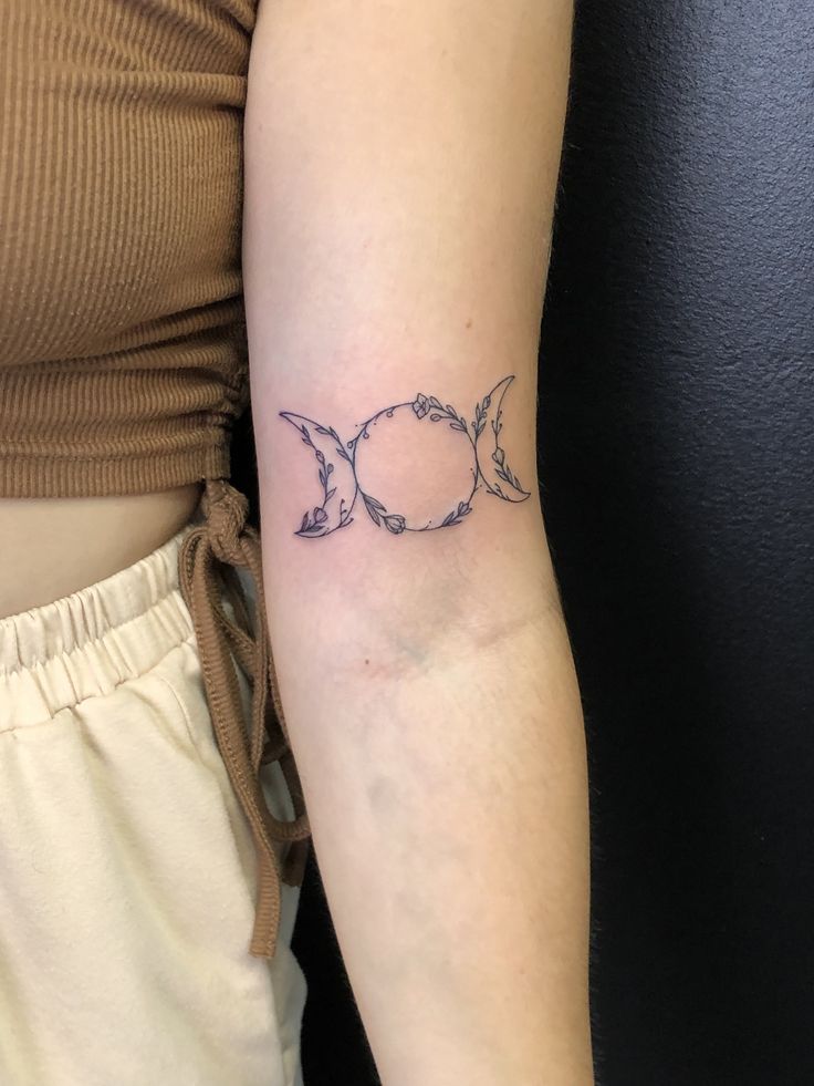 Triple goddess symbol tattoo