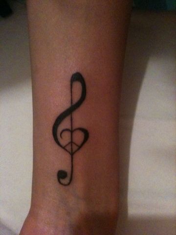 I fell for this design: Peace, Love & Music. Might be getting this for my fifth Tattoo (Safe to say I looove Tattoos)