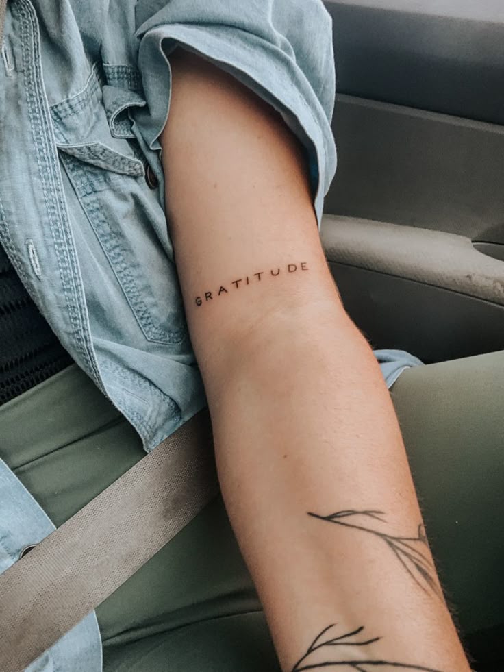 Gratitude arm tattoo