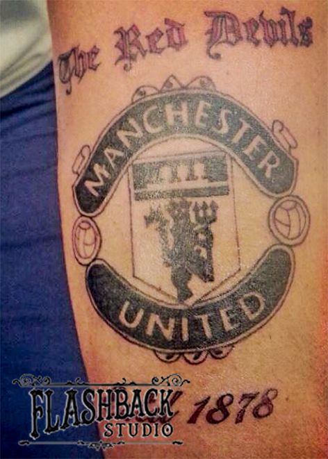 Manchester United forearm tattoo