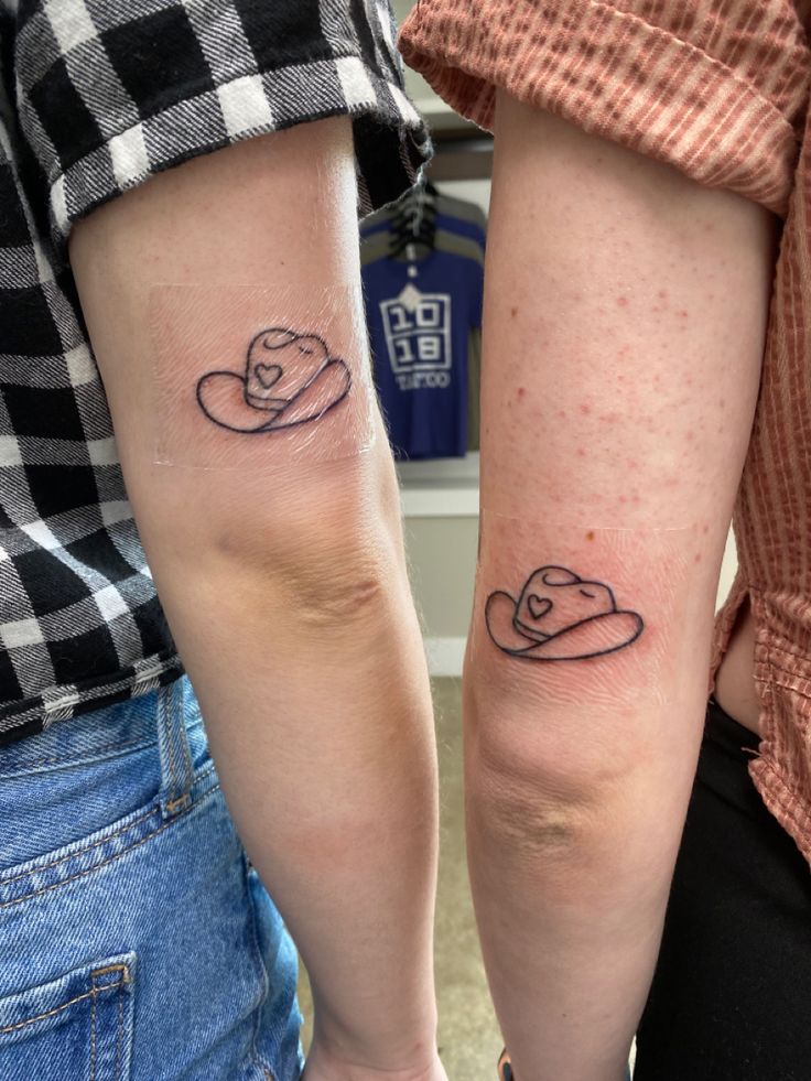 Matching cowboy hat tattoos