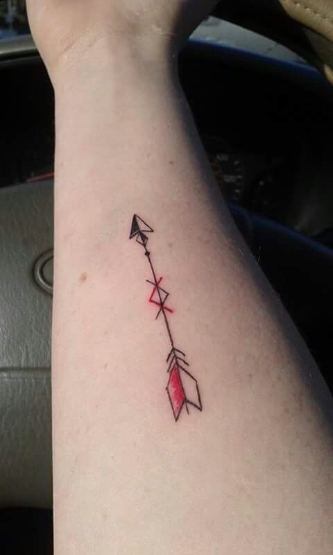 An arrow tattoo. Has the viking symbol in the middle showing "When there's a will, there's a way". Red to represent my love/sacrifice. Arrow because you have to be pulled back in