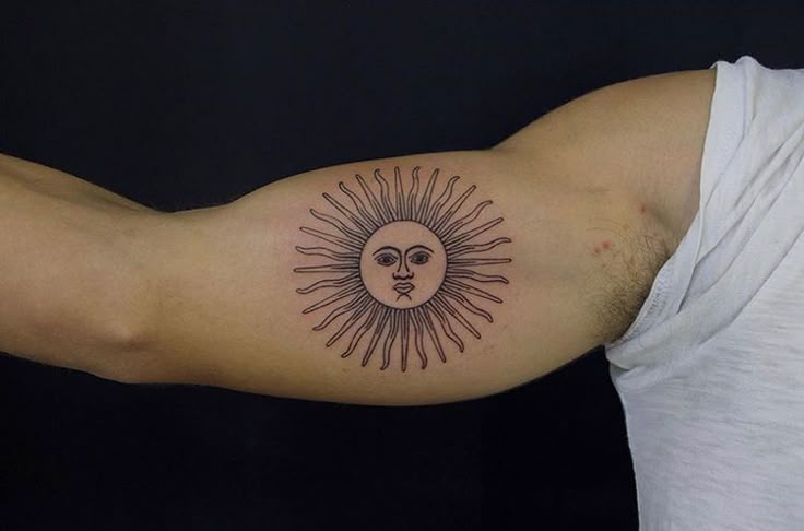 Argentina Sun On bicep Hon Tattoo
