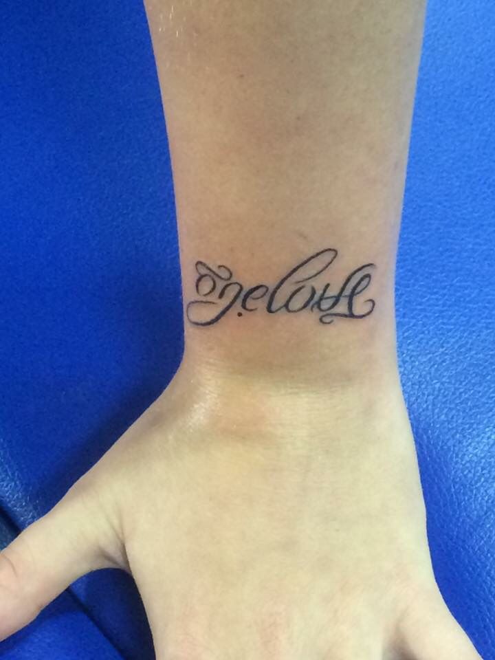 This way says "one love" Turn it upside down and it says "family" My  daughters first