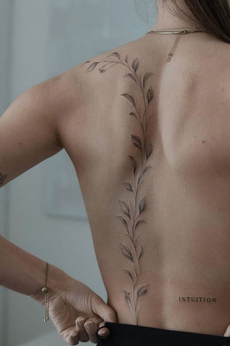 Delicate Floral Back Tattoo - Intuition-Inspired Body Art for Women