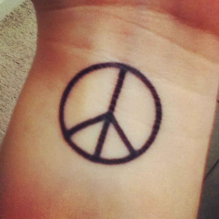 Peace sign tattoo