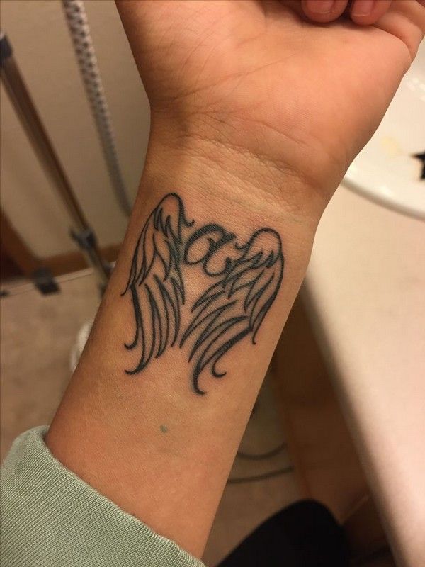55+ Ingenious Angel Wings Tattoo Designs for Men & Women