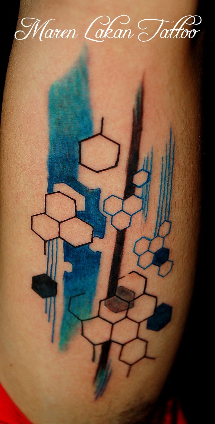 geometric tattoo, very cool, love the colors, they make it seem cold,  mechanical.