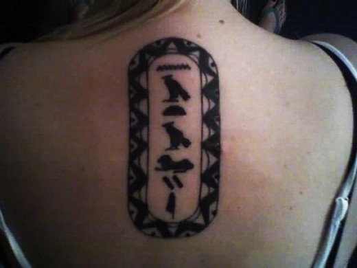 Hieroglyphs in a cartouche.