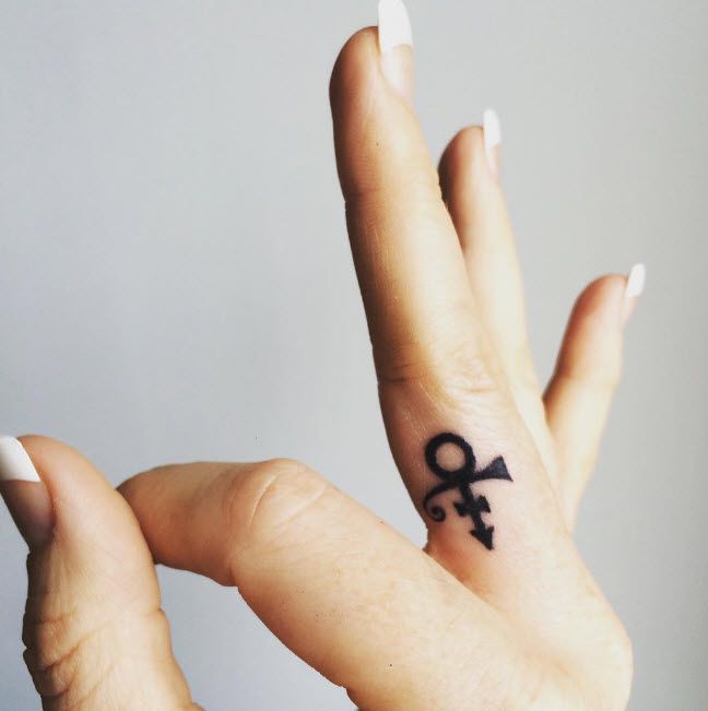 19 pretty epic Prince tattoos making us want to queue up 'Purple Rain'