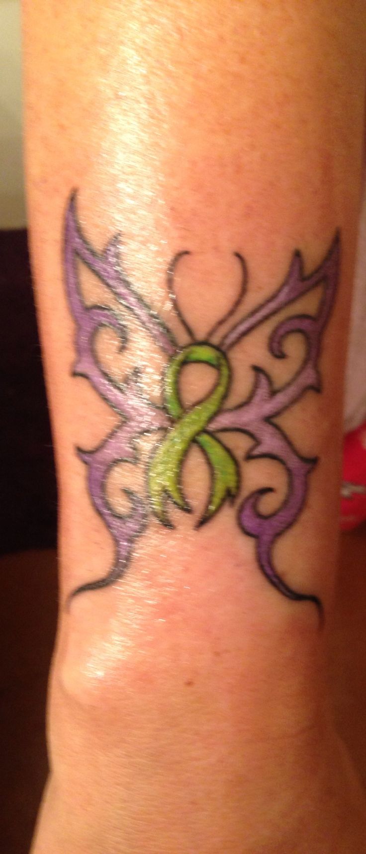 My #6 tattoo March 8,2014 lime green ribbon for bipolar awareness, lavender  wings Hodgkin's lymphoma awareness and purple blended my favorite color.  The butterfly symbolizes resurrection, metamorphosis, change evolution