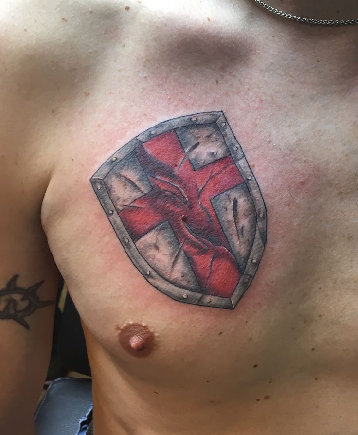 Shield of Faith tattoo, cover up, armor, cross. Battle worn.