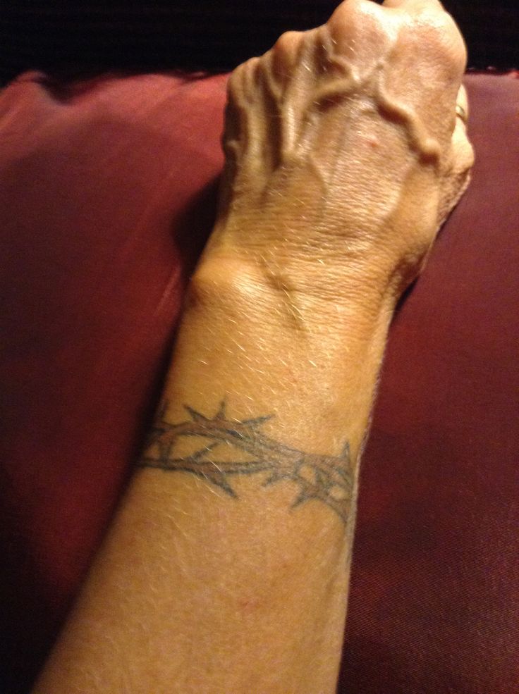 Crown of Thorns/Jesus. Goes completely around the wrist as a bracelet would  be