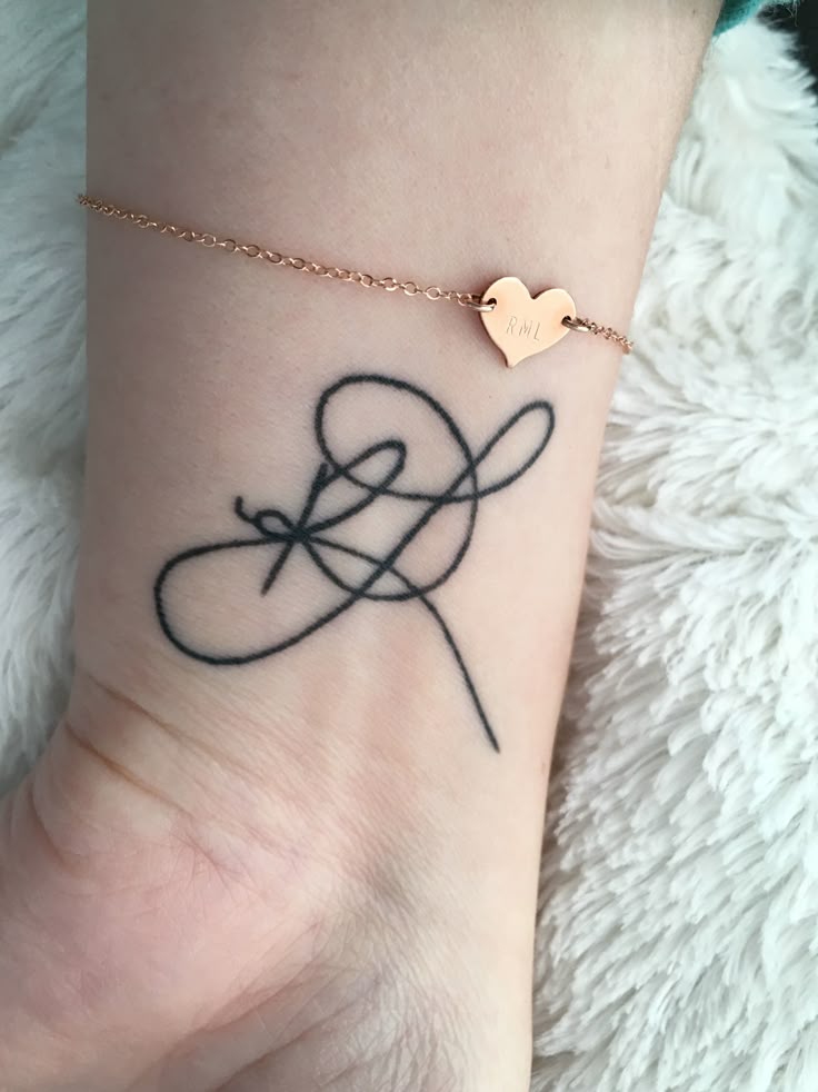 Initial tattoo “RL”