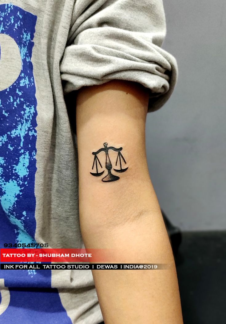 JUSTICE TATTOO