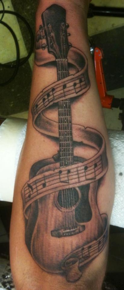 Black and Grey Guitar With Music Notes Tattoo By Russell Fortier at Lucky 7  Tattoo-Tahoe