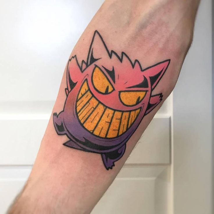 Gengar Pokémon tattoo on the right inner forearm.