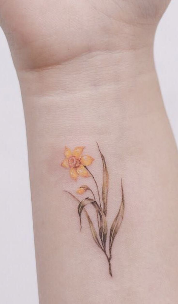 Pin by Casey Roehm Nolan on tats | Daffodil tattoo, Trendy tattoos, Name  flower tattoo