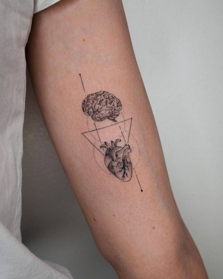 FIne line brain vs. heart tattoo on the inner arm | Small forearm tattoos,  Small tattoos for guys, Tattoos for guys