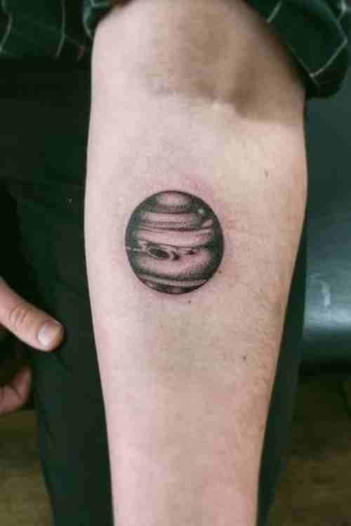Small black neptune tattoo by @justinersst