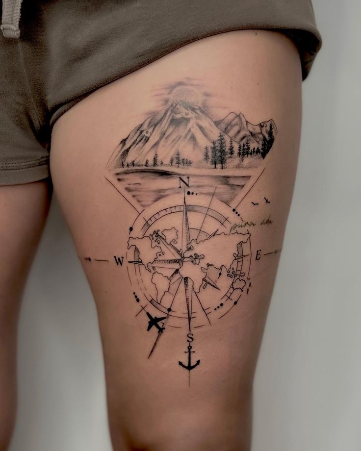 Dotwork Compass Tattoo Inside a World Map on the Thigh: Worldly Direction