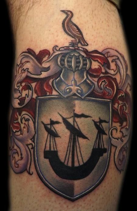 Cute family crest with ship tattoo design for men