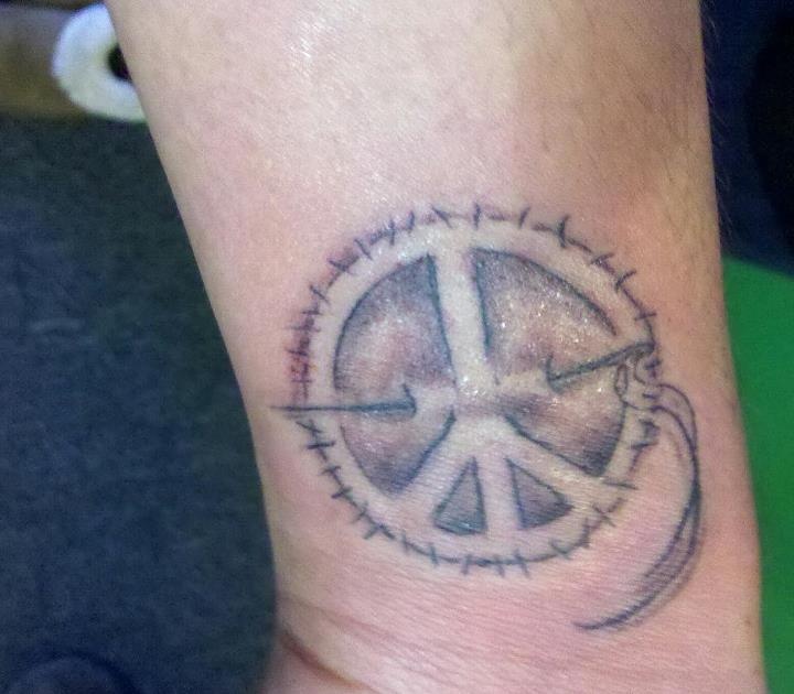 peace sign tattoo with a needle and stitching to represent my love of  fashion and my obsession with peace signs <3