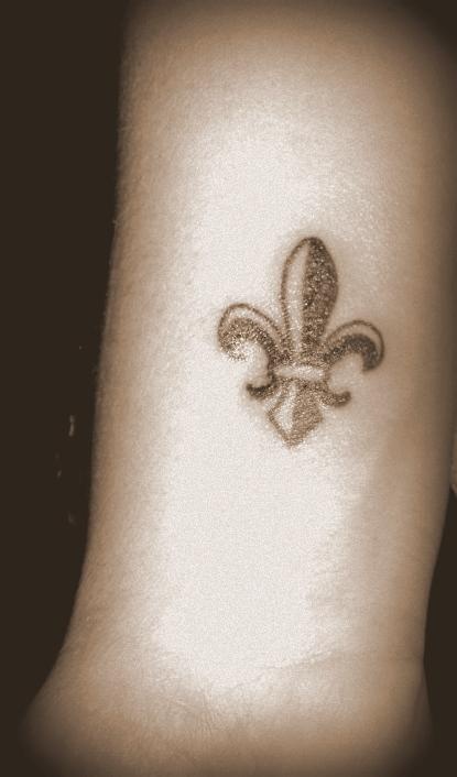 This is on my right wrist. It's for my love of NOLA!! The Fleur De Lis has  become the signature symbol of the rebirth of the City after Hurricane  Katrina. The city